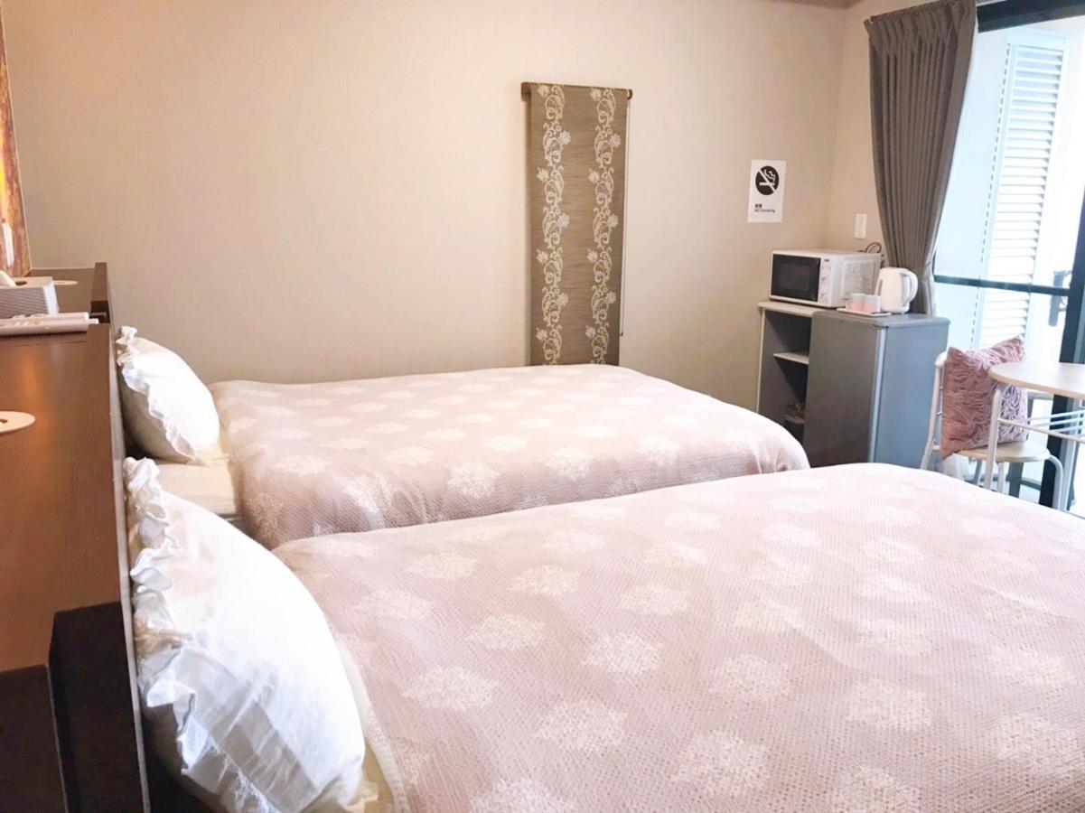 月の道テラス Hotell Motobu Exteriör bild
