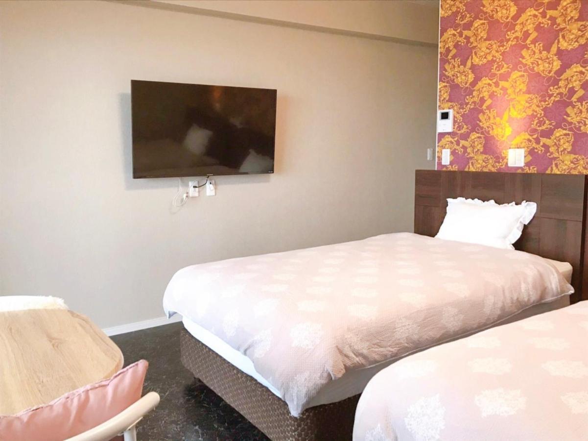 月の道テラス Hotell Motobu Exteriör bild
